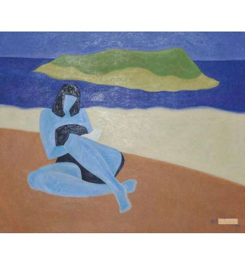 A Girl Lying On The Beach And Reading