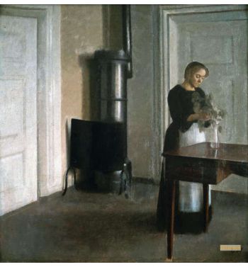 Interior Of Woman Placing Branches In A Vase On Table